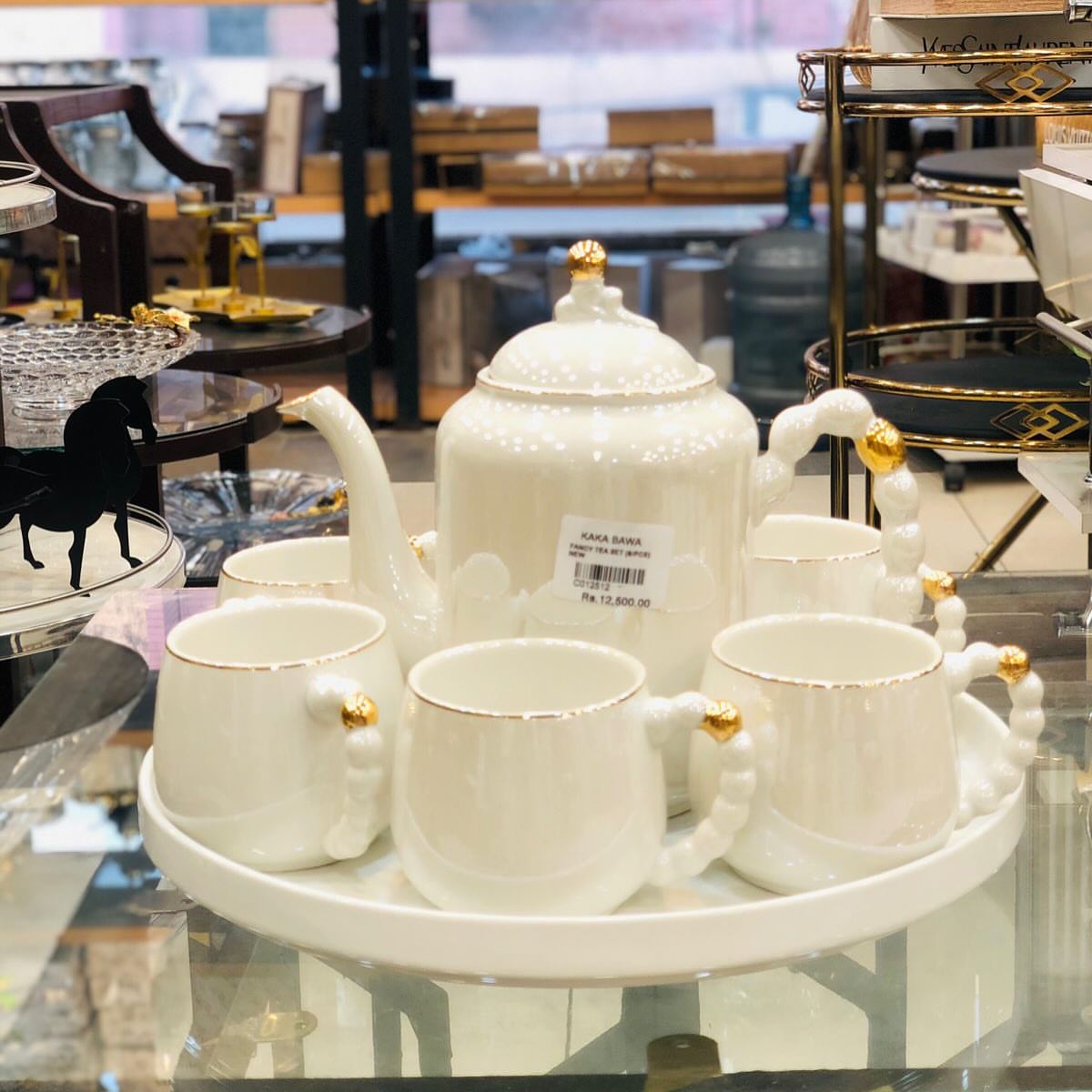 Luxury Porcelain Revolving Tea Set With Gradient Pearl Handles
